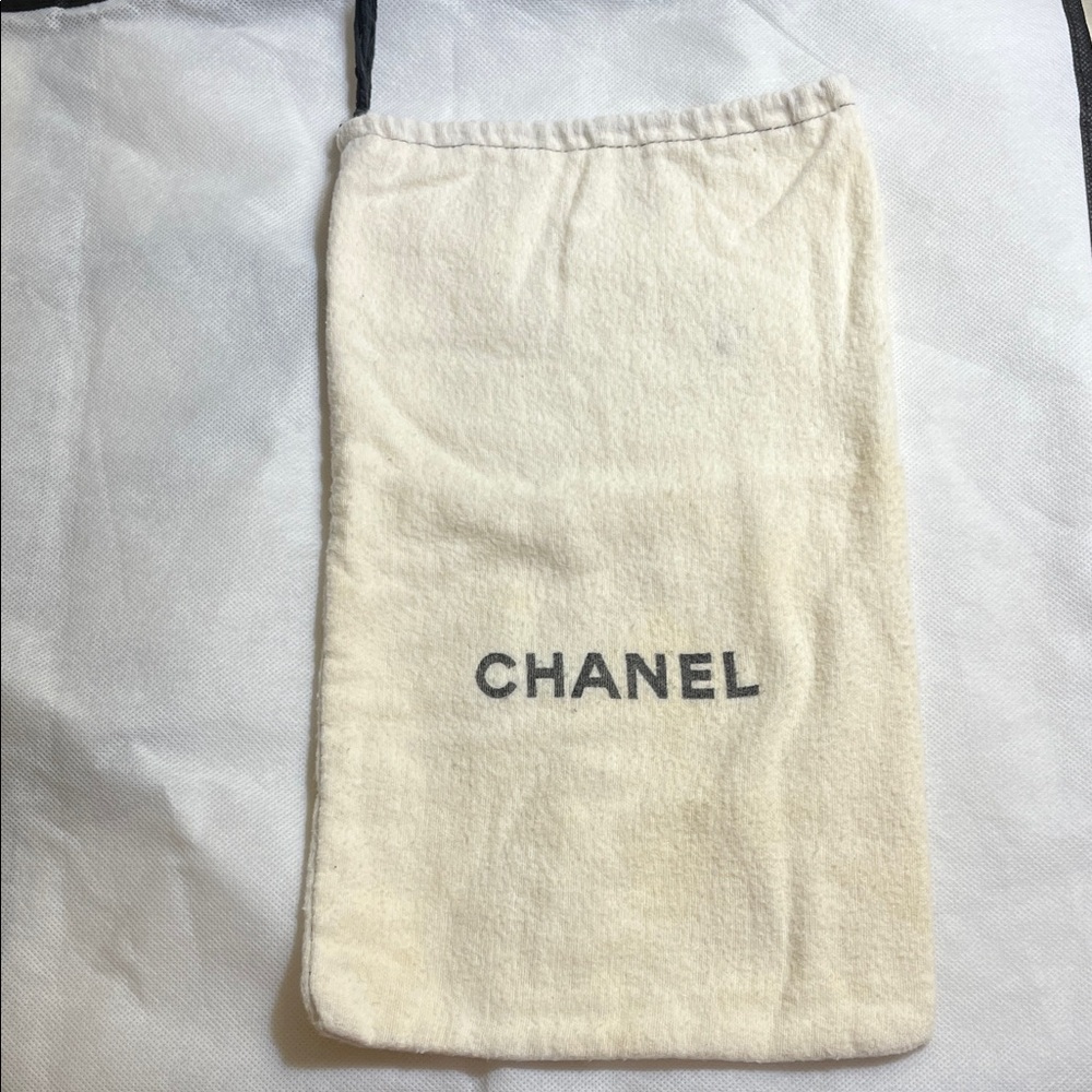 CHANEL Cream Dust Bag with Black Logo